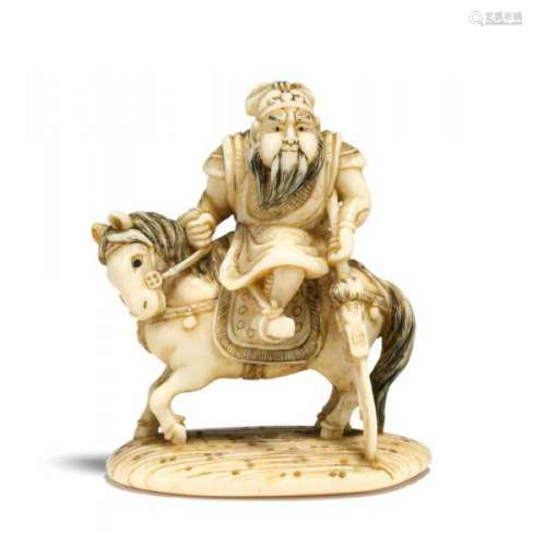 NETSUKE: KAN'U WITH HIS HALBERD 'GREEN DRAGON' RIDING A HORSE. Japan. 19th c. Ivory [...]