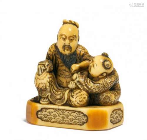 NETSUKE: CHINESE WITH KARAKO ON BASE. Japan. 18th c. Ivory with engravings stained [...]