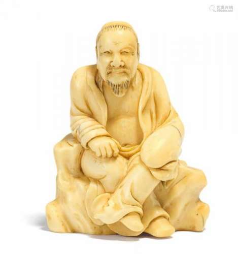 NETSUKE OF A CHINESE SCHOLAR ON A ROCK THRONE. Japan. 18th c. Ivory. Back with golden [...]