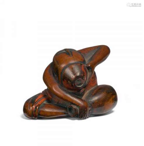NETSUKE: SAKE DRINKER. Japan. 19th c. Box wood with residue of Negoro lacquer. Height [...]