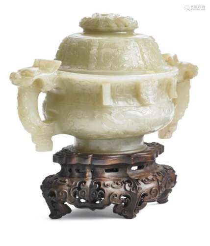 A Chinese archaic Style greenish jade covered circular bowl with handles. Qing, [...]