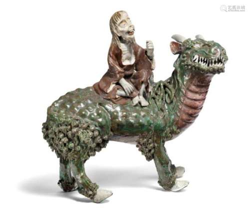 A Chinese Shiwan stoneware censer in the shape of a qilin with a riding Immortal [...]