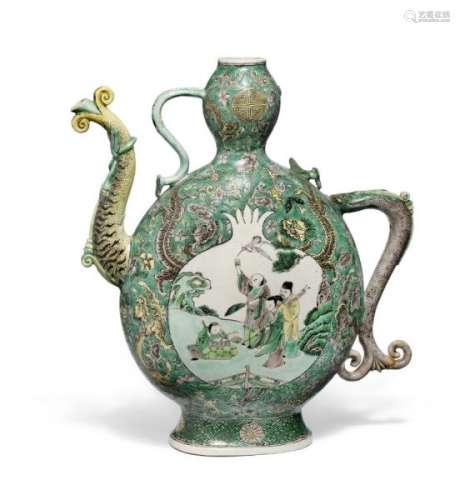 A Chinese famille verte enamel sur biscuit wine ewer decorated in colours the sides [...]