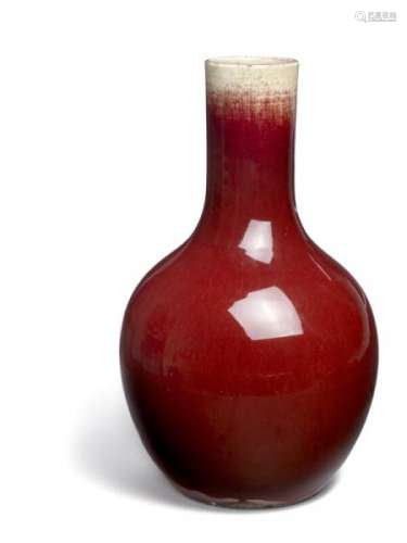 A Chinese sang de boeuf porcelain bottle vase. 19th century. H. 38 cm.  -