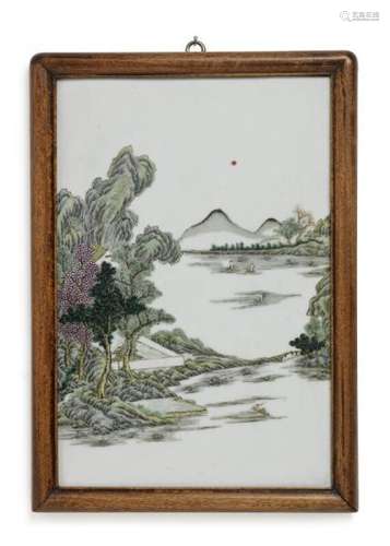 A Chinese porcelain plaque decorated in colours with riverscape with figures, boats, [...]