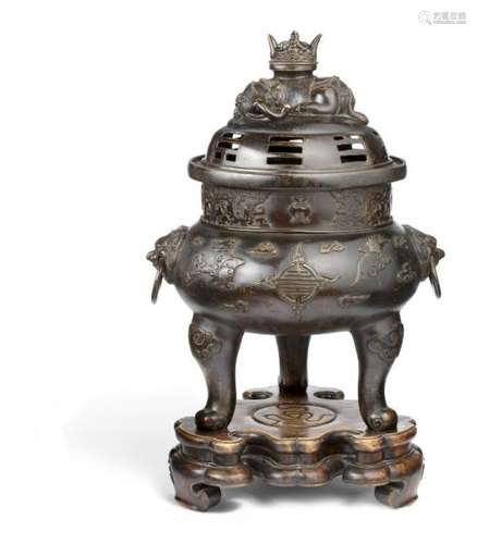 Large Chinese bronze tripod censer with cover supported by three legs, sides with to [...]