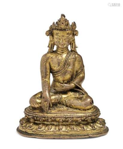 A Tibetan/Nepali gilt copper figure of the crowned Buddha. 14th-15th century. Weight [...]