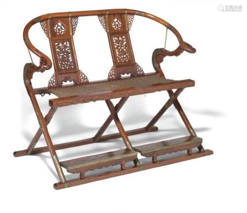 A Chinese two-seat hardwood folding bench carved with openwork back, wattle seat and [...]