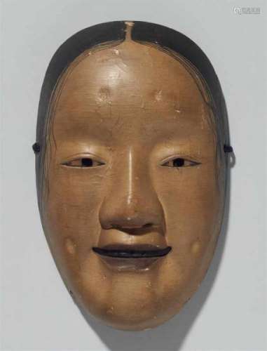 A painted wood nô mask. 19th centuryZô onna type with regular features and smiling [...]