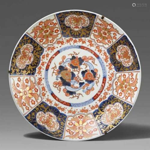 A large Imari charger. Arita. 19th centuryPainted in underglaze-blue, iron-red and [...]