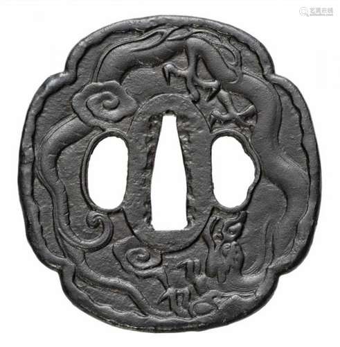 An iron tsuba. Edo periodOf mokkô shape with a descending dragon in low relief. [...]