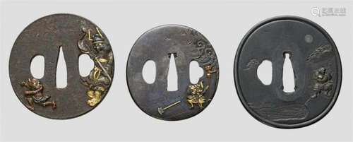 Three tsuba. 18th/19th centurya) Of almost round shape, iron, in relief with mixed [...]