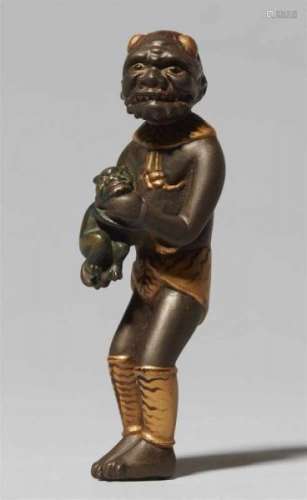 A lacquered wood netsuke of a standing oni. Late 19th centuryHolding a tiny oni with [...]