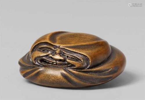 A boxwood netsuke of a Daruma doll. 19th centuryFlattened and stylized and [...]