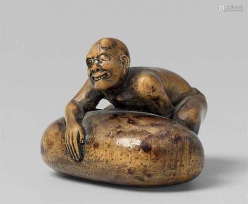 A light wood netsuke of a blind stone lifter. Late 19th centuryGrabbing a huge stone [...]