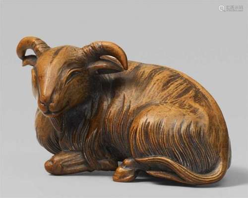 A boxwood okimono netsuke of a long-haired goat. 19th centuryRecumbent, the forelegs [...]