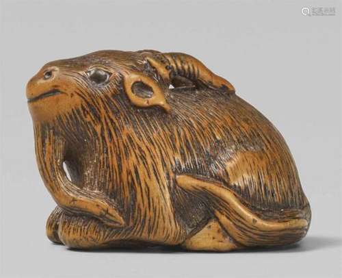 A boxwood netsuke of a recumbent goat. Mid-19th centuryLying with its legs folded [...]