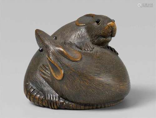 A boxwood netsuke of two rats. 19th centuryA boxwood netsuke of two rats looking up, [...]