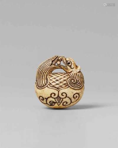 A bone netsuke of a mokugyo. Late 19th centuryThe upper part of a gong with a handle [...]