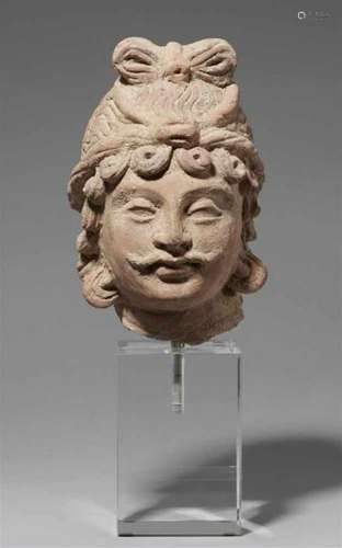 A Gandhara unfired clay head of a bodhisattva. Pakistan. 4th/5th centuryWith [...]