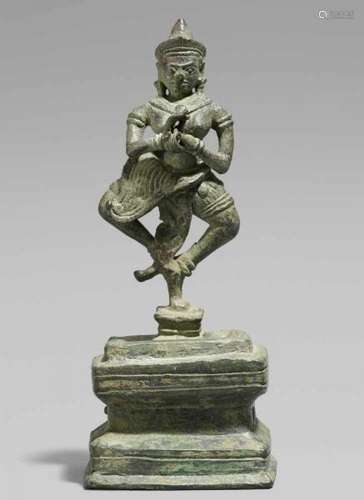 A Khmer bronze figure of a dancing dakini. Cambodia. 12th centuryStanding on one leg [...]