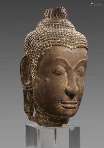 An very large Ayutthaya sandstone head of a Buddha. Thailand. 15th/16th centuryThe [...]