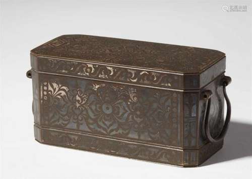 An oblong bronze and silver inlay betel nut box (lotoan) of the Maranao tribe. Southern