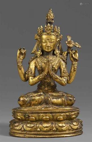 A Tibetan gilt bronze figure of Shadakshari Avalokiteshvara. 17th/18th centurySeated [...]