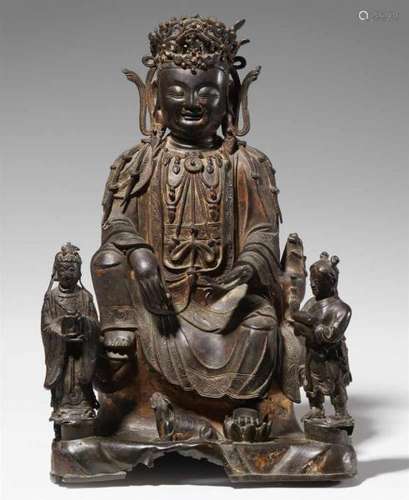 A bronze figure of Guanyin. Ming dynasty, 17th centurySeated in maharajalila on a [...]