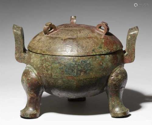 A large bronze tripod ritual food vessel (ding) and cover. North-central China, [...]