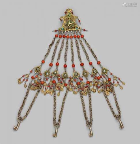 A Uzbekistan bridal jewellery of gilt silver and with corals and turquoises. Chiwa, [...]