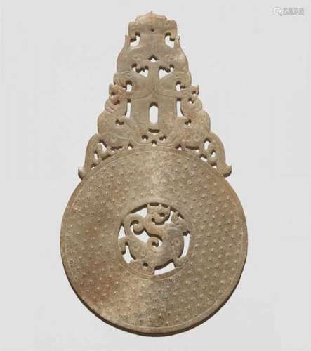 A greyish green jade bi disc. In the style of the 2nd century BCThe disc with comma [...]