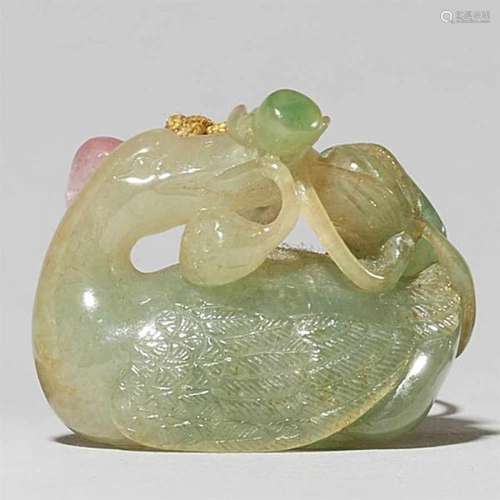 A small greenish jade pendantIn shape of a duck with the stems of a lotus flower, a [...]