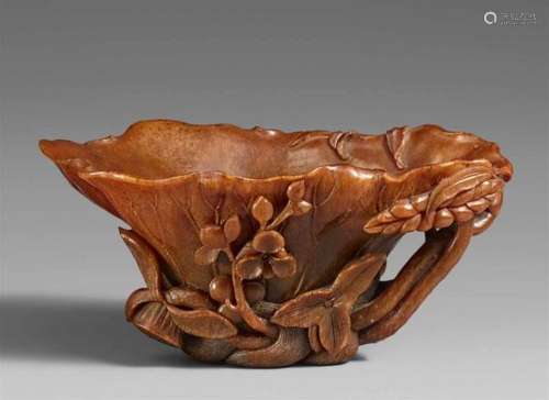 A rhinozeroshorn cup. 18th centuryIn shape of a lotus leaf, surrounded by waves which [...]