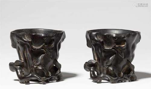 Two almost identical black wood libation cups, probably zitan woodBoth cups entwined [...]