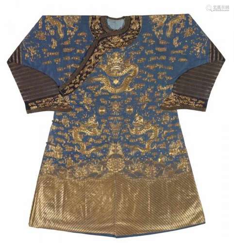 A semi-official embroidered blue silk dragon robe (longpao). 19th centuryButtoned [...]