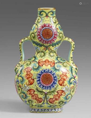 A yellow ground famille rose double-gourd vase. 20th centuryOf flattened double-gourd [...]