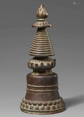 A Tibetan bronze Kadampa-stupa. TibetCast in the Kadampa style, the bell-shaped stupa [...]