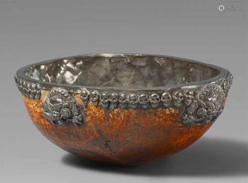 A Tibetan silver lined kapalaThe silver decorated exterior with a band of repoussé [...]