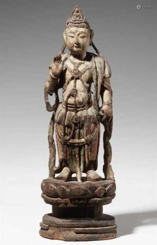 A polychromed wood figure of Guanyin. In the style of the Ming periodStanding on a [...]