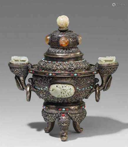 A large Mongolian silver lidded vessel. 20th centuryOn three lion head feet, with two [...]