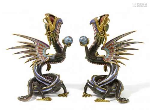 A pair of cloisonné enamel winged dragons. Around 1900Their winding bodies forming [...]