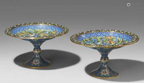 A pair of cloisonné enamel footed bowls. Around 1900The shallow bowl with various [...]