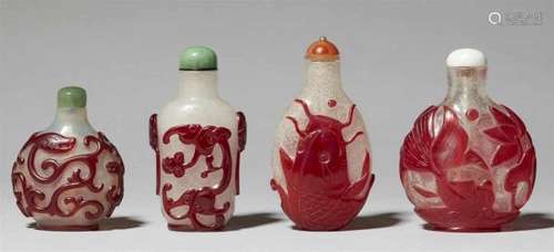 Four red overlay snuff bottles. 18/19th centuryDecorated with a) red overlay of three [...]