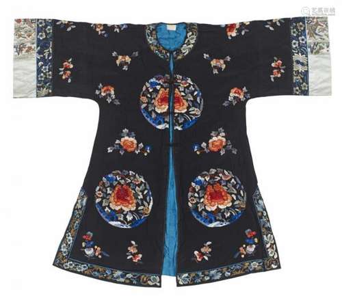 A woman's embroidered black silk jacket. Early 20th centuryButtoned in the middle and [...]