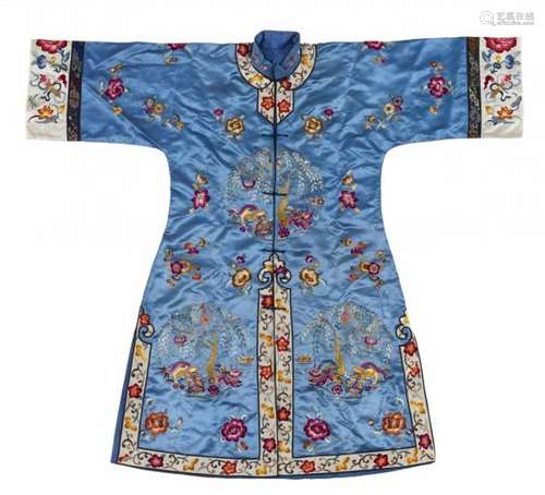 A lady's embroidered blue satin gown. First half 20th centuryButtoned down in the [...]