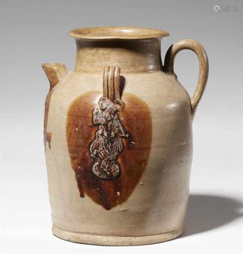 A brown-splashed straw-glazed ewer. Tang dynasty (618-907)Of ovoid form with rounded [...]