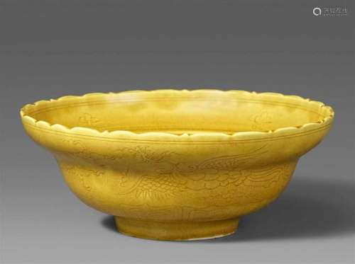 A yellow-glazed bowl. Qing dynasty (1644-1911)Decorated to the exterior with two incised