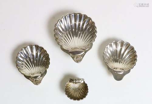 A set of 4 silver graduating shell design Dishes, …