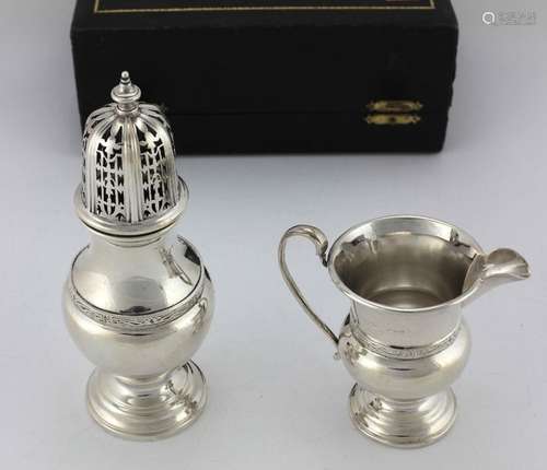 A cased Presentation silver Sugar Castor and Cream…